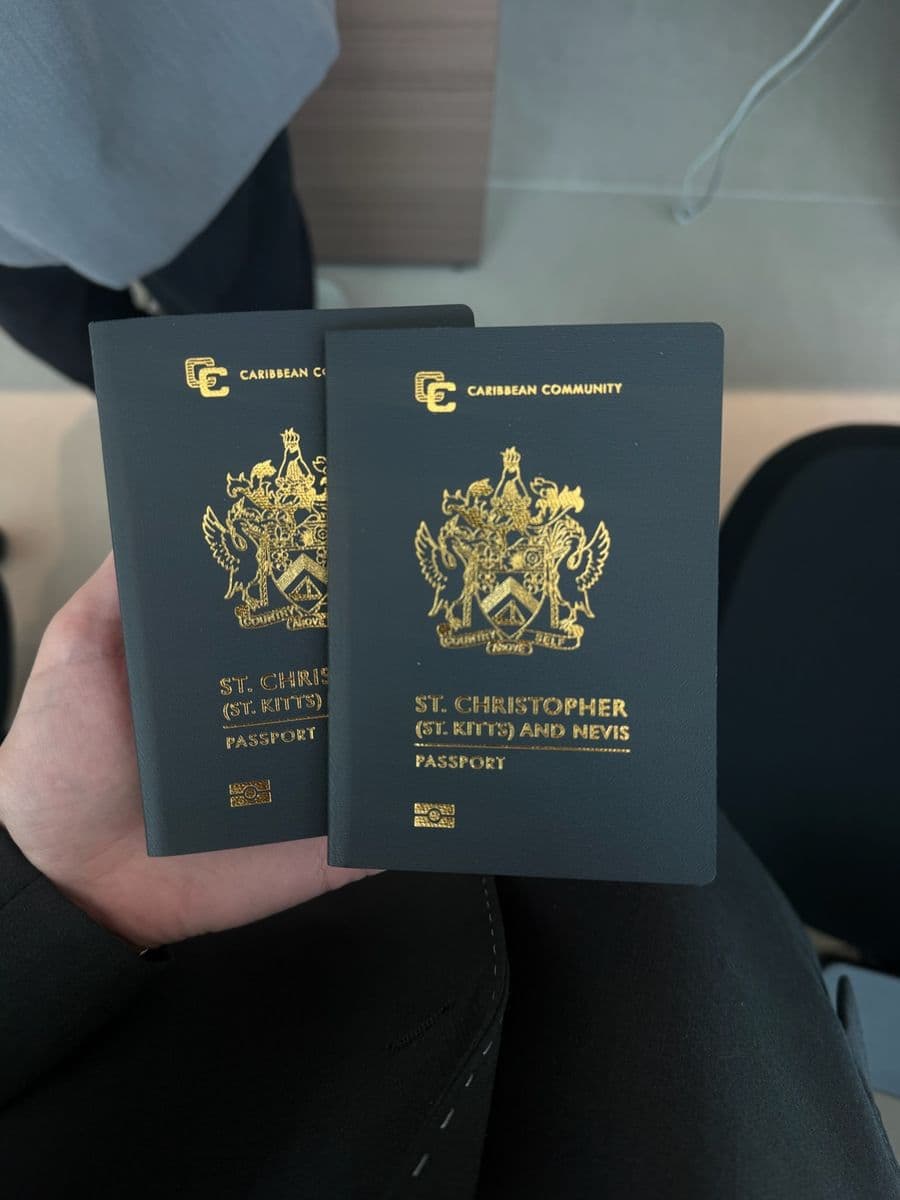Two St Kitts and Nevis passports held up in the Soland office